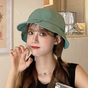 Stylish green ruffled bucket hat for women providing excellent sun protection in summer.