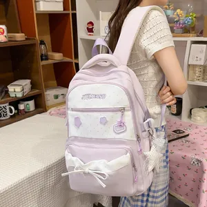 Cute Korean style lavender student backpack featuring decorative bow and star charms
