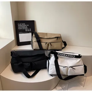 Detailed view of three trendy multi-pocket crossbody sports bags in khaki, black, and white