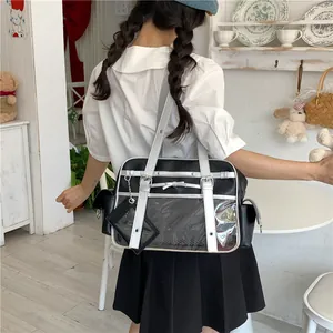 Japanese style black and white ita bag with transparent window shown on a model