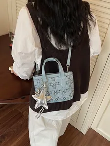 Elegant light blue beaded crossbody handbag with star charm for stylish women