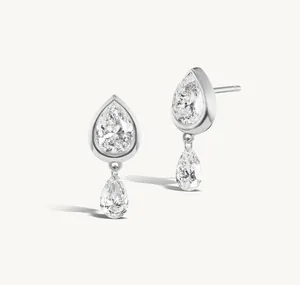 Detailed close-up of S925 sterling silver earrings with pear-shaped cubic zirconia drops