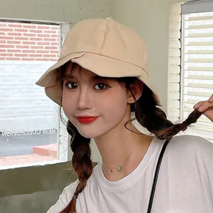 Japanese style beige ruffled bucket hat with wide brim for women's sun protection