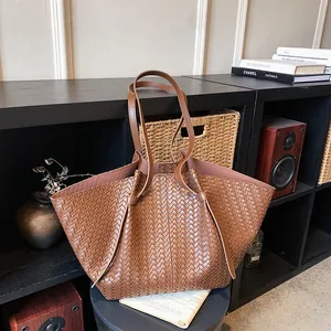 Brown woven minimalist tote bag with premium texture for women