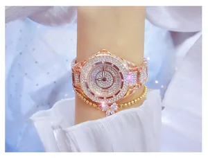 Detailed view of rose gold women's watch and butterfly bracelet set with crystals