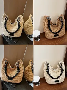 Stylish hand-woven bucket bag for women featuring a unique black beaded handle design