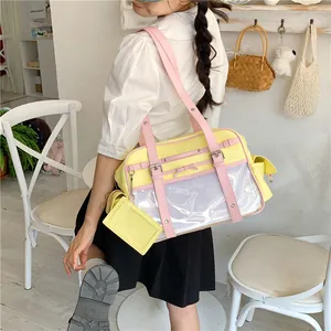 Detailed view of the cute Japanese style yellow tote bag with a pink strap and window.
