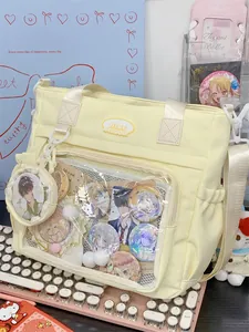 Yellow ita-bag tote with clear display pocket for anime pins and character merchandise