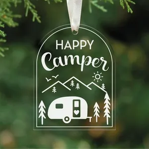 Detailed view of arched acrylic Christmas ornament featuring a Happy Camper design
