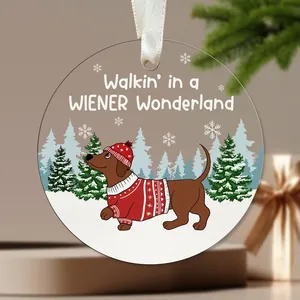 Round acrylic Christmas ornament with a cute dachshund in a snowy forest design.