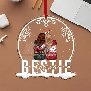 Detail view of acrylic Christmas ornament featuring two friends and Bestie forever text