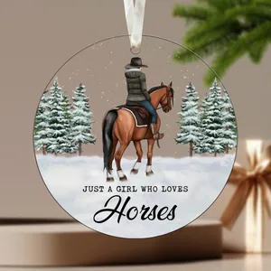 Acrylic Christmas ornament featuring a girl riding a horse in snow with festive pine trees