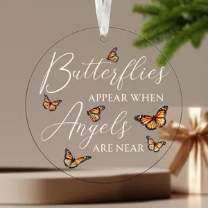 Detailed view of clear acrylic butterfly ornament with memorial quote
