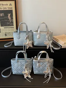Elegant light blue and silver small tote bags for women with star charms and quilted patterns