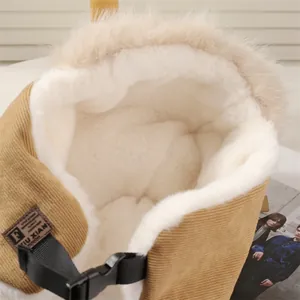 Close-up detail of the thick faux fur lining and corduroy exterior of the winter trapper hat.