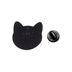 Detail of the back of a black cat-shaped enamel pin with a rubber clutch.