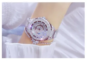 Detailed view of a luxury full diamond silver women's watch with matching bracelet