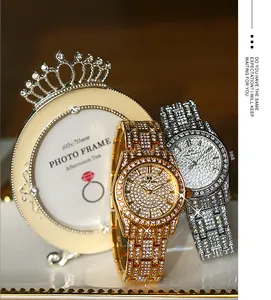 Close-up detail of gold and silver BS luxury iced out watches with full diamond crystal