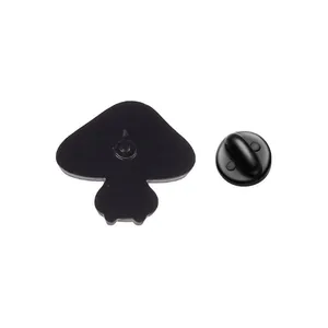 Detailed back view of a cute mushroom enamel pin showing the metal post and black rubber clutch.