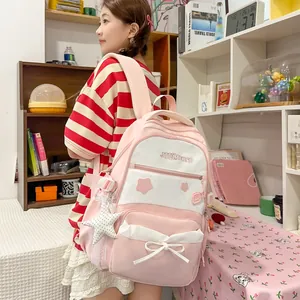 Large-capacity pink and white school backpack with cute star pendant and bow detail