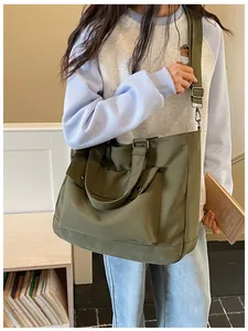 Stylish olive green large capacity tote bag shown being worn as a daily crossbody bag
