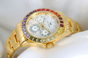 Detailed view of BS women's gold quartz watch featuring a vibrant rainbow gemstone bezel