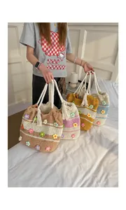 Collection of colorful hand-woven crochet tote bags with floral details and rope handles