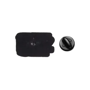 Detailed back view of a black enamel pin showing the metal needle and rubber clutch