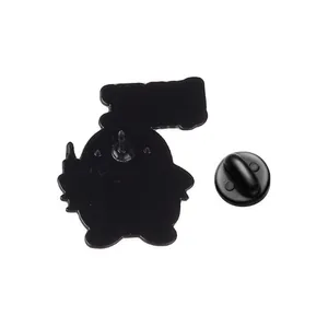 Close-up back view of a quirky duck metal brooch with black rubber clutch fastener
