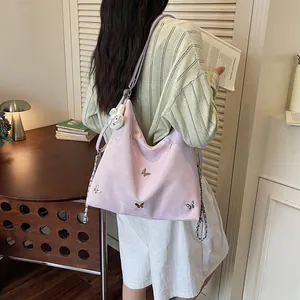 Large pink multi-functional shoulder bag with butterfly appliques and cute rabbit charm