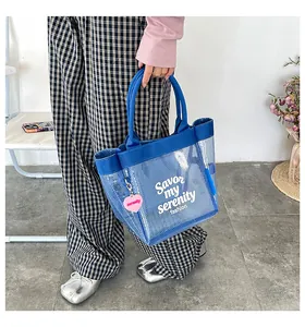 Stylish blue mesh transparent handbag featuring serenity heart charm for summer fashion
