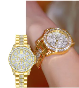 Detailed close-up view of gold luxury women's watch with full crystal pavé and multi-dial face