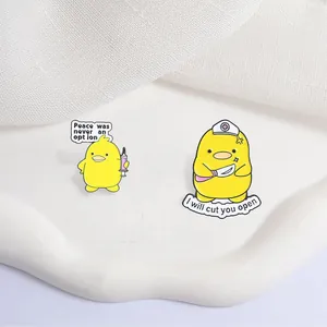Close-up of funny yellow duck enamel pins featuring quirky medical theme and quotes