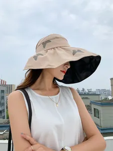 Stylish women's wide brim sun hat with butterfly patterns and black vinyl lining for UV protection
