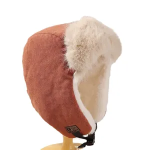 Women's warm winter trapper hat featuring plush fur lining and durable corduroy fabric
