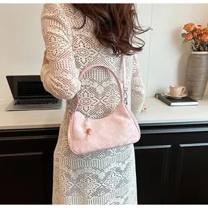 Pink New Chinese style underarm bag with textured finish and elegant bead charm