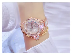 Detailed close-up showing a luxury rose gold women's watch with full rhinestone inlay on wrist