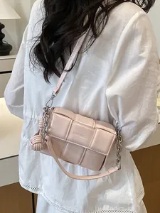 Stylish light pink woven padded square shoulder bag with silver chain strap and knot charm