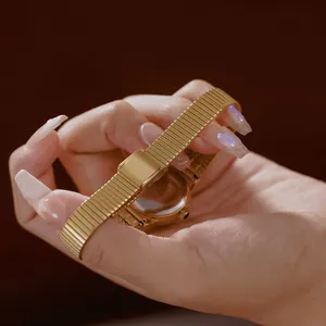 Macro detail of a vintage gold stainless steel ladies watch with unique bamboo link strap