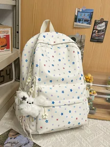 Japanese style white backpack featuring colorful star prints and cute plush charm pendant