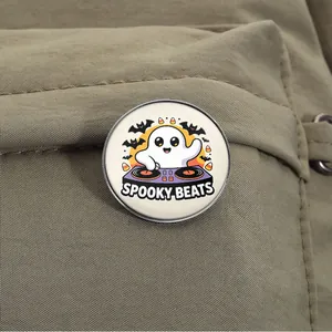 Close-up of a Spooky Beats ghost DJ metal badge pinned on a canvas backpack