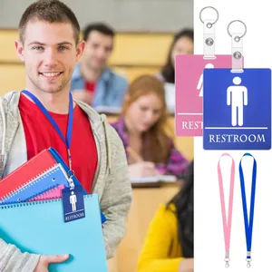 Juego de pases de baño de PVC azul y rosa con cordones a juego para el uso escolar