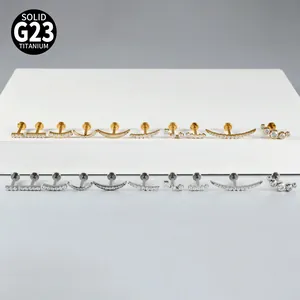 Collection of G23 titanium labret studs with zircon inlays in gold and silver finishes