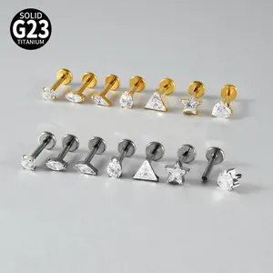 Detailed view of G23 titanium internal thread studs with assorted zircon shapes and finishes
