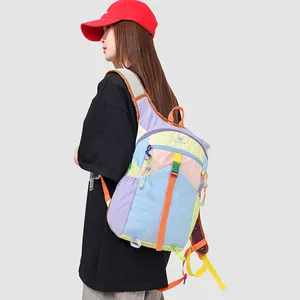 Model wearing dopamine colorblock large capacity backpack for outdoor travel and fitness