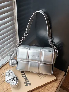 Metallic silver woven padded square crossbody shoulder bag with chunky chain strap and charm
