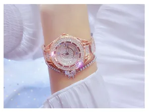 Detail of a luxury rose gold women's watch fully encrusted with shimmering rhinestones