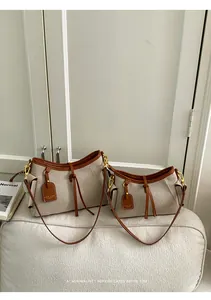 Bolsos hobo de lona retro minimalistas en dos tamaños con elegantes detalles en cuero marrón