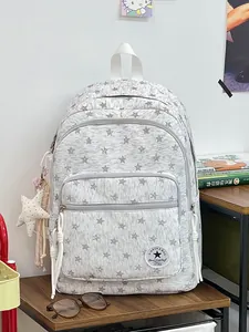 Stylish gray school backpack for students with white stars pattern and star pendant