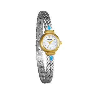 Elegante reloj de pulsera para mujer en oro y plata con circonitas azules de pera